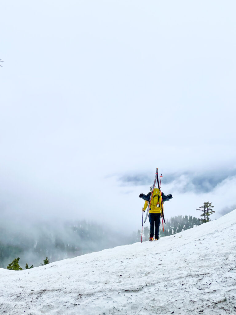 A ski mountaineer makes their approach to the peak to make some ski turns on an American Alpine Institute ski course