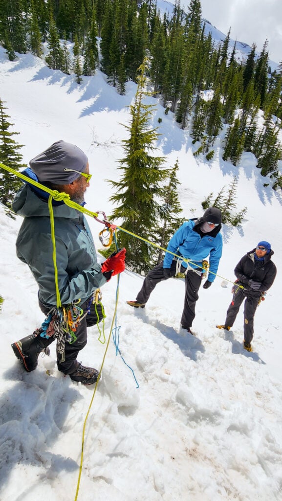Students learn rope rescue skills in the Mountain Center classroom at the American Alpine Institute on a rope rescue course