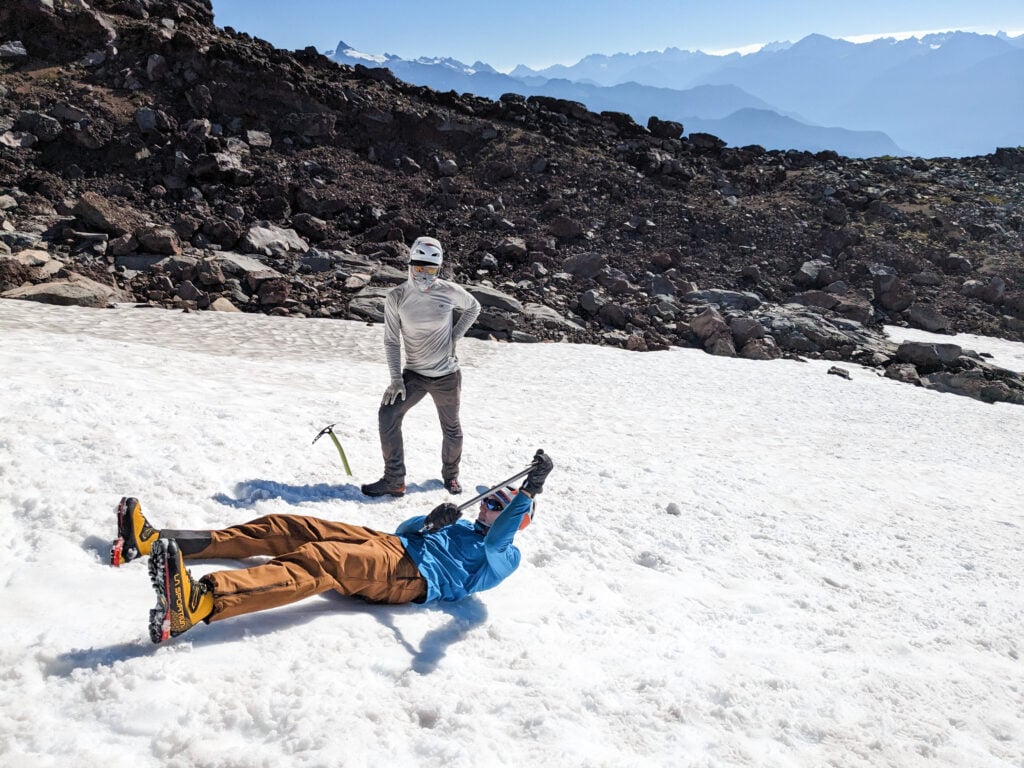 A student practices self arrest on the glaciers of Mt. Baker during and American Alpine Institute mountaineering program