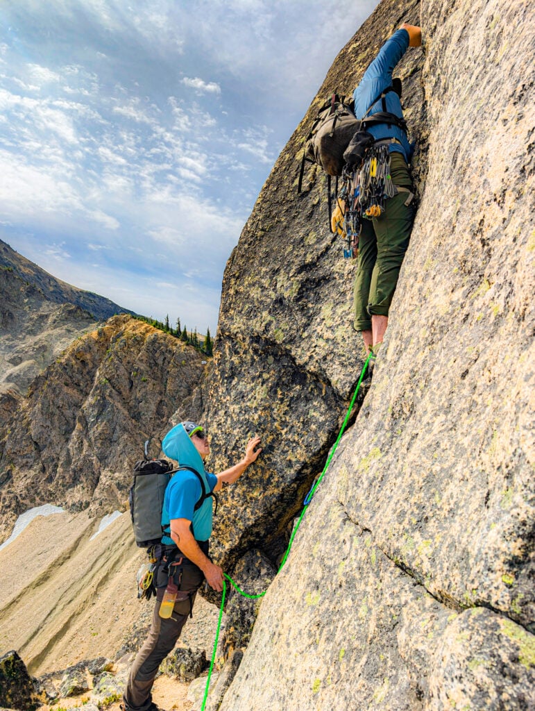 Climbers start the next pitch on North Cascades alpine rock with the American Alpine Institute rock climbing program