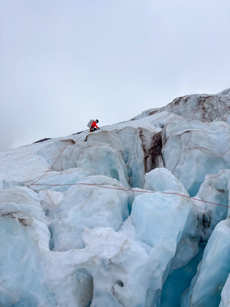 Climbers navigating complex glacier terrain on Mt. Baker during an American Alpine Institute mountaineering program