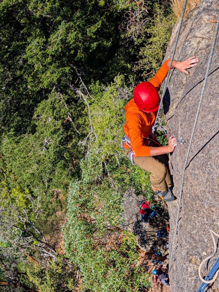 A climber makes their way up a route on a top rope at Mt. Erie in Washington on an American Alpine Institute rock climbing course