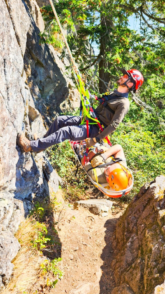A student learns how to ascend with a patient in a litter as part of the American Alpine Institute rope rescue courses