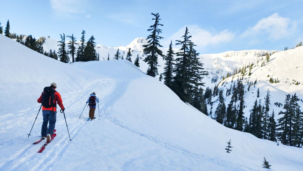 Skiers backcountry tour to get away from the crowds on an American Alpine Institute ski course in the Mt. Baker backcountry
