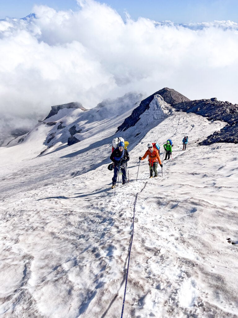 A team of climbers near the summit on the Kautz Route of Mt. Rainier during an American Alpine Institute mountaineering program