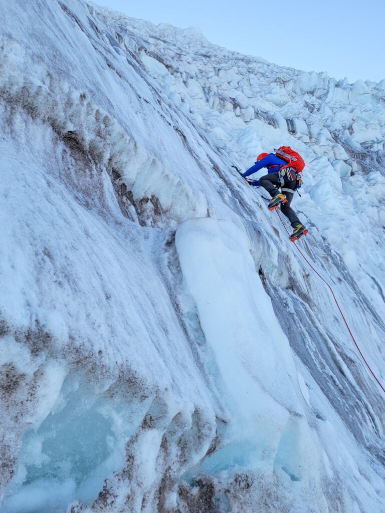 A climber gains an icy wall to the summit of Mt. Rainier on an American Alpine Institute mountaineering course